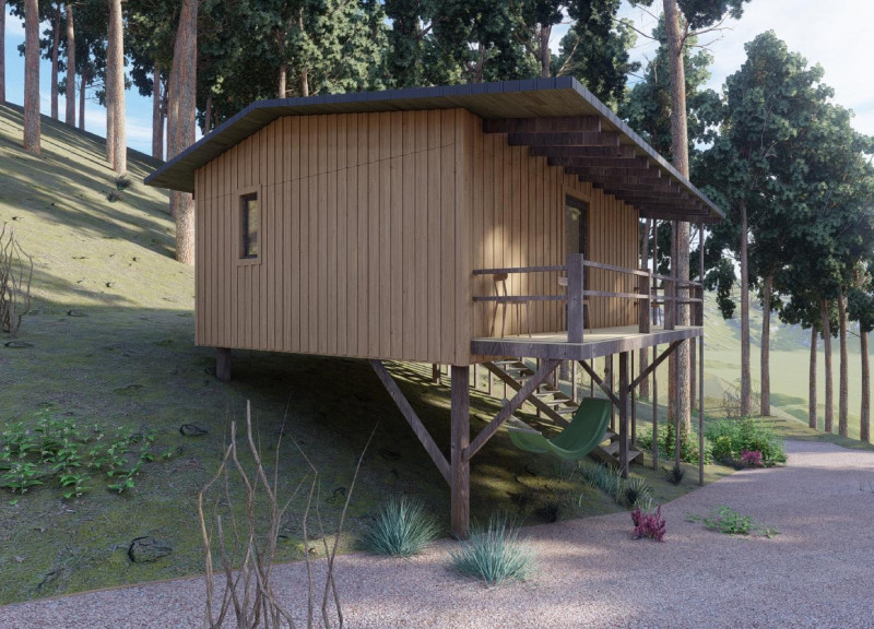 Elevated Cabins Featuring Locally Sourced Wood and Corrugated Metal in a Tranquil Forest Setting