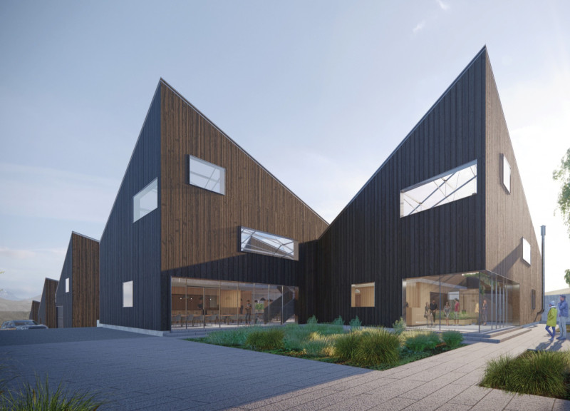 Charred Wood Facade Complementing Microclimates in a Community Greenhouse